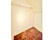 An empty closet with white walls, wire shelf, and brown tile floor at 2705 Greystone Pl, Austell, GA 30106