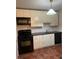 Functional kitchen with black appliances, white cabinetry, and a convenient layout at 2705 Greystone Pl, Austell, GA 30106