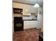 This is a kitchen with an oven, a microwave and white cabinets at 2705 Greystone Pl, Austell, GA 30106