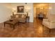 Cozy living room featuring tile floors, a comfortable sofa, and a dining area in the background at 2705 Greystone Pl, Austell, GA 30106