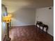 A well-lit living room with tile floors, two flower lamps, and a console table at 2705 Greystone Pl, Austell, GA 30106