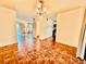Open living room with tile floors, chandelier lighting and bright, airy atmosphere at 2705 Greystone Pl, Austell, GA 30106