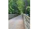 Scenic walking path surrounded by lush green trees and nature at 2705 Greystone Pl, Austell, GA 30106