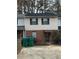 Inviting two-story townhouse with brick and siding exterior and well-kept landscaping at 2705 Greystone Pl, Austell, GA 30106