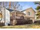 Exterior of home showcasing a backyard with a deck, grassy lawn, and mature trees providing shade and privacy at 370 Charlyne Way, Dacula, GA 30019