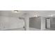 Unfinished basement featuring concrete floors, white walls, and a door, ready for your creative renovation at 370 Charlyne Way, Dacula, GA 30019