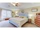 A bright bedroom with a trey ceiling, plush carpet, and a large window at 370 Charlyne Way, Dacula, GA 30019