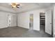 A bright bedroom with a trey ceiling, plush carpet, and multiple closets at 370 Charlyne Way, Dacula, GA 30019