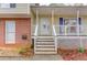 Charming front porch with white railing and stairs leading to a classic front door, creating a welcoming entrance at 370 Charlyne Way, Dacula, GA 30019