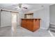 Finished basement with a custom bar, tiled floor, and modern sliding door at 2612 Grove Park Ln, Conyers, GA 30094