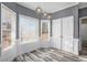 Cozy breakfast nook with luxury vinyl plank flooring, a wall of windows, and ample natural light at 2612 Grove Park Ln, Conyers, GA 30094