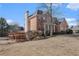 Brick and siding exterior with a pergola feature plus a spacious lawn at 2612 Grove Park Ln, Conyers, GA 30094