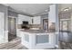 Well-lit kitchen featuring modern appliances, a breakfast bar, and luxury vinyl plank flooring at 2612 Grove Park Ln, Conyers, GA 30094