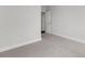 A freshly painted bedroom with neutral carpet offers plenty of natural light at 822 Urban Grange Way, Suwanee, GA 30024