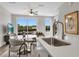 Bright open-concept living area with a kitchen featuring a quartz countertop island and stainless sink at 822 Urban Grange Way, Suwanee, GA 30024