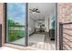 Modern living area with a view from sliding glass doors out to the balcony at 822 Urban Grange Way, Suwanee, GA 30024