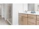 Bright bathroom featuring a modern vanity with a quartz countertop and a glass-enclosed shower at 913 Echo Park Dr, Suwanee, GA 30024