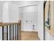 Hallway with a view of the laundry room at 913 Echo Park Dr, Suwanee, GA 30024