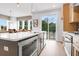 Kitchen with a large island, stainless steel appliances, wood cabinets and an open layout at 913 Echo Park Dr, Suwanee, GA 30024
