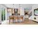 Modern kitchen featuring stainless steel appliances, a kitchen island with seating, and dark backsplash at 913 Echo Park Dr, Suwanee, GA 30024