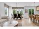 Open floor plan with stylish living room, dining area, and modern kitchen with a bright airy feel at 913 Echo Park Dr, Suwanee, GA 30024