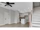 Bright and airy open-concept space with hardwood floors, modern finishes, and a staircase leading upstairs at 923 Echo Park Dr, Suwanee, GA 30024
