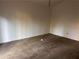 Bedroom with neutral carpet and walls, creating a blank canvas for personalization and decor at 7472 Wood Ct, Lithonia, GA 30058