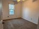 Bright bedroom with large window providing natural light and views of the surrounding neighborhood at 7472 Wood Ct, Lithonia, GA 30058
