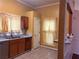 Kitchen featuring cabinets, granite countertop, and bright sunny walls at 7472 Wood Ct, Lithonia, GA 30058