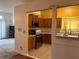 Kitchen features cabinets, granite countertop, and bright sunny walls at 7472 Wood Ct, Lithonia, GA 30058