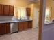 Kitchen with wooden cabinets, stainless steel dishwasher, and granite countertops at 7472 Wood Ct, Lithonia, GA 30058