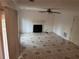 Cozy living room featuring a fireplace, neutral tile flooring, and ample natural light at 7472 Wood Ct, Lithonia, GA 30058