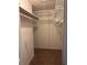 Spacious walk-in closet with wire shelving, offering ample storage for clothing and accessories at 7472 Wood Ct, Lithonia, GA 30058
