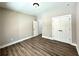 A modern bedroom featuring closet space, neutral paint, and sleek flooring at 15 Stratford Way, Kingston, GA 30145