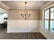 Bright dining room with a modern chandelier and large windows offering plenty of natural light at 15 Stratford Way, Kingston, GA 30145