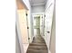 Well-lit hallway featuring modern doors and stylish, durable flooring throughout at 15 Stratford Way, Kingston, GA 30145