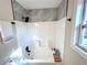 Updated bathroom with a shower/tub combo and marble tile at 204 Apple Branch Dr, Woodstock, GA 30188