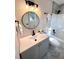 Modern bathroom with grey vanity, bathtub, and marble flooring at 204 Apple Branch Dr, Woodstock, GA 30188