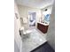 Elegant bathroom with double vanity, walk-in shower, and bedroom view at 204 Apple Branch Dr, Woodstock, GA 30188