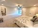 Large bedroom with carpeted floor, ceiling fan and sliding glass door to patio at 204 Apple Branch Dr, Woodstock, GA 30188