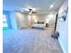 Spacious bedroom with carpeted floor, ceiling fan, and access to backyard at 204 Apple Branch Dr, Woodstock, GA 30188