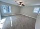 Large bedroom featuring ample natural light and carpet flooring at 204 Apple Branch Dr, Woodstock, GA 30188