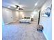 Spacious bedroom with carpeted floor, ceiling fan, and access to backyard at 204 Apple Branch Dr, Woodstock, GA 30188