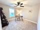 Versatile bedroom or office space with a desk and window at 204 Apple Branch Dr, Woodstock, GA 30188
