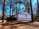 Side view of the house showcasing white siding and black accents at 204 Apple Branch Dr, Woodstock, GA 30188