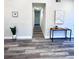Bright hallway with wood-look floors and neutral walls at 204 Apple Branch Dr, Woodstock, GA 30188