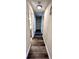 Bright hallway with wood-look flooring and access to multiple rooms at 204 Apple Branch Dr, Woodstock, GA 30188