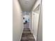Bright hallway with wood-look flooring leading to living area at 204 Apple Branch Dr, Woodstock, GA 30188
