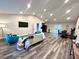 Open concept living room featuring hardwood floors and ample natural light at 204 Apple Branch Dr, Woodstock, GA 30188