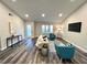 Spacious living area with hardwood floors and a neutral color palette at 204 Apple Branch Dr, Woodstock, GA 30188